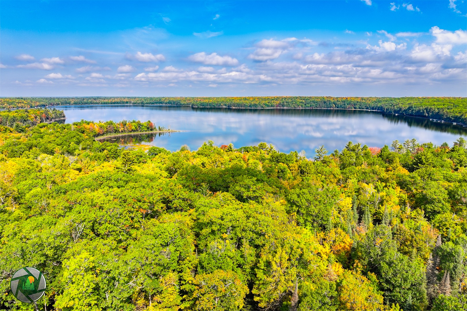 Lake Laura today with a splash of Fall color 🍁